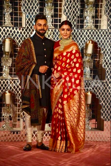 Virat Kohli-Anushka Sharma reception red kajeevaram saree. Image courtesy pinkvilla